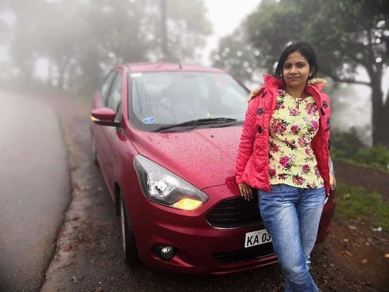 Personal moment with a car parked in Chikmagalur during monsoon, capturing the essence of a road trip in lush surroundings