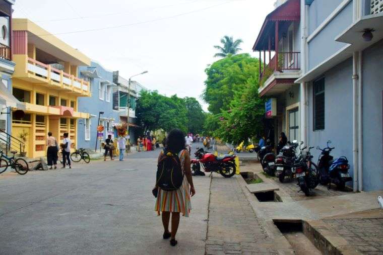 French Colony in Pondicherry - An ultimate walking guide 9 That's me walking in the Vysial Street of Pondicherry French Town. Pretty 2-storeyes houses in pastel shades adorn both sides of the road. The greenery adds to the charm of this nice walkable area.