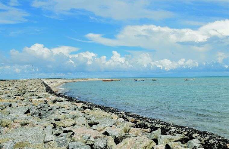 boats floating near the spectacular Dhanushkodi Beach on a clear sunny day