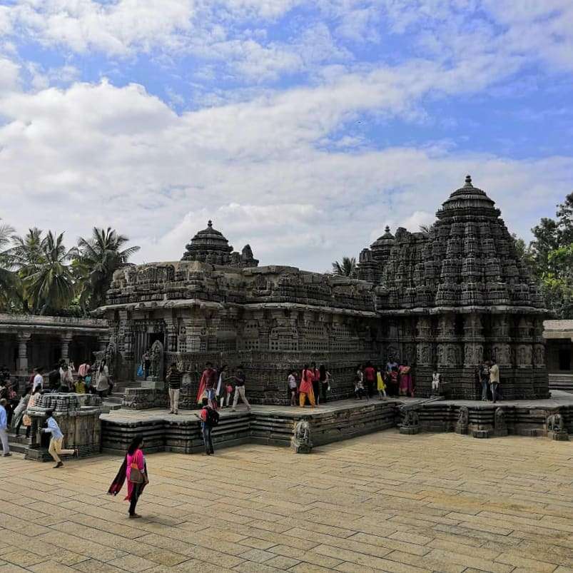 The majestic ancient temple with the white clouds of a sunny day in the backdrop