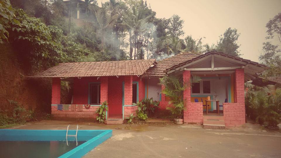 This red colored building is a quaint little homestay with a pool in a coffee estate in Coorg. We stayed here on our Bangalore to Coorg road trip