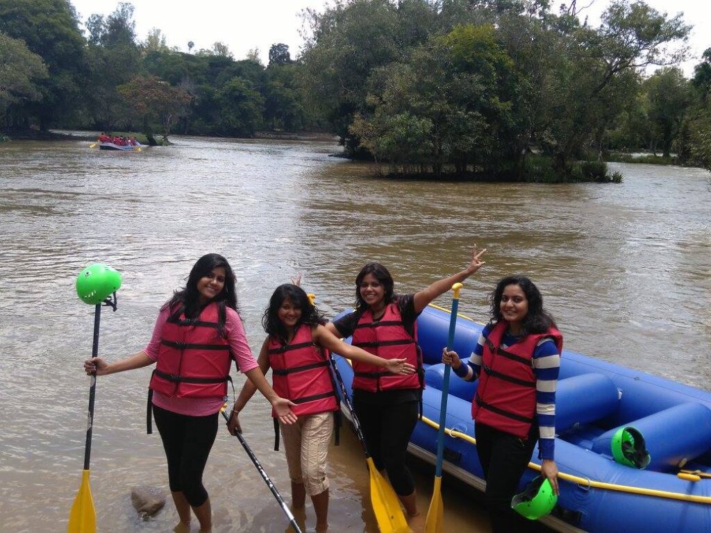 A group of four girls ready to embark on the river rafting adventure in Coorg