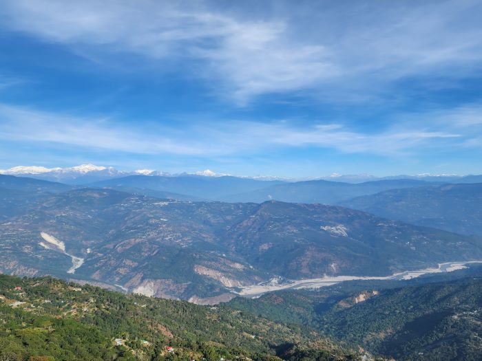 Top 17 Places with the Best Views of Kanchenjunga 2 Scenic view from a room at Summit Sherpa in Delo Hill, Kalimpong, highlighting the magnificent Kanchenjunga and the winding Teesta River